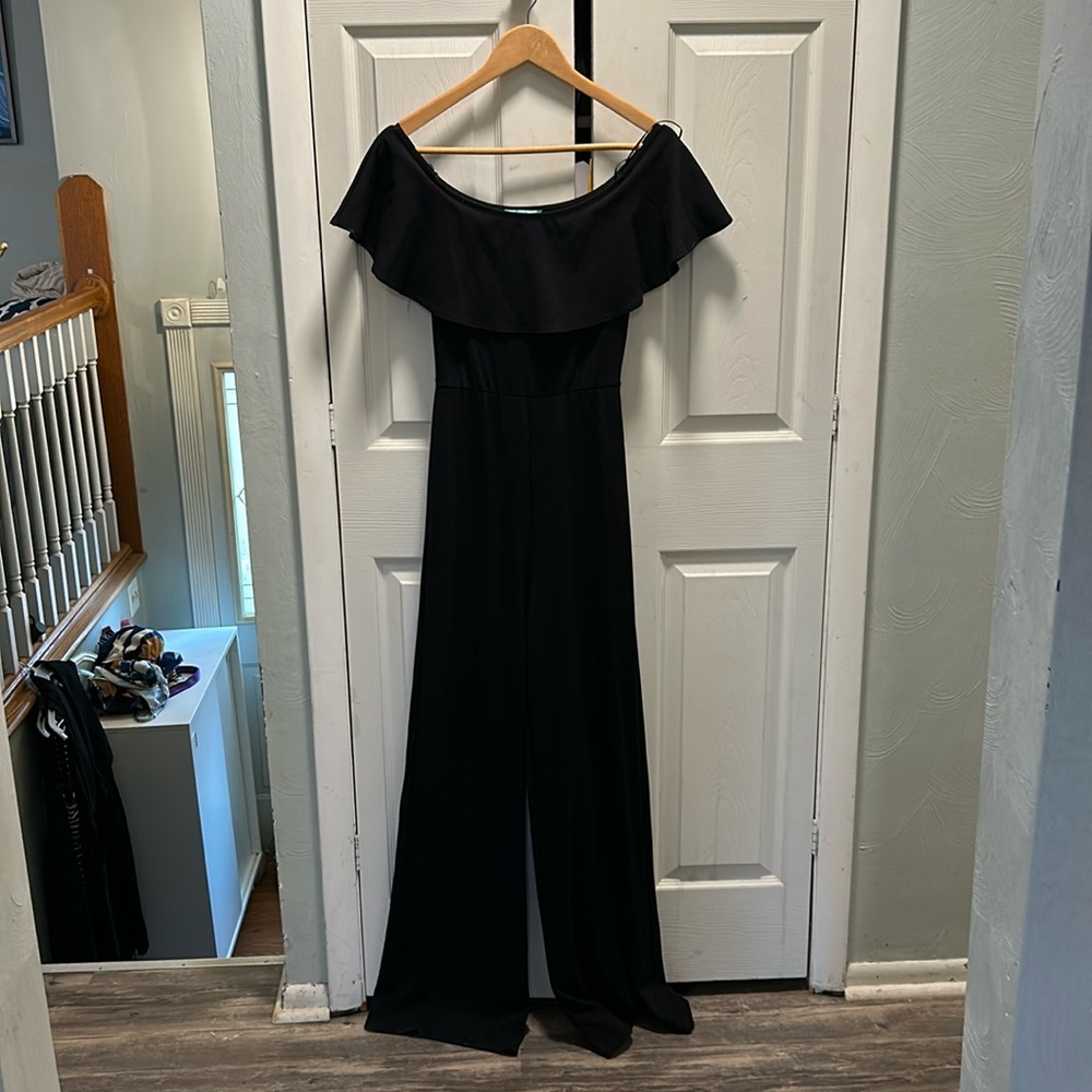 Off the shoulder, wide leg, black jumper. Size small.